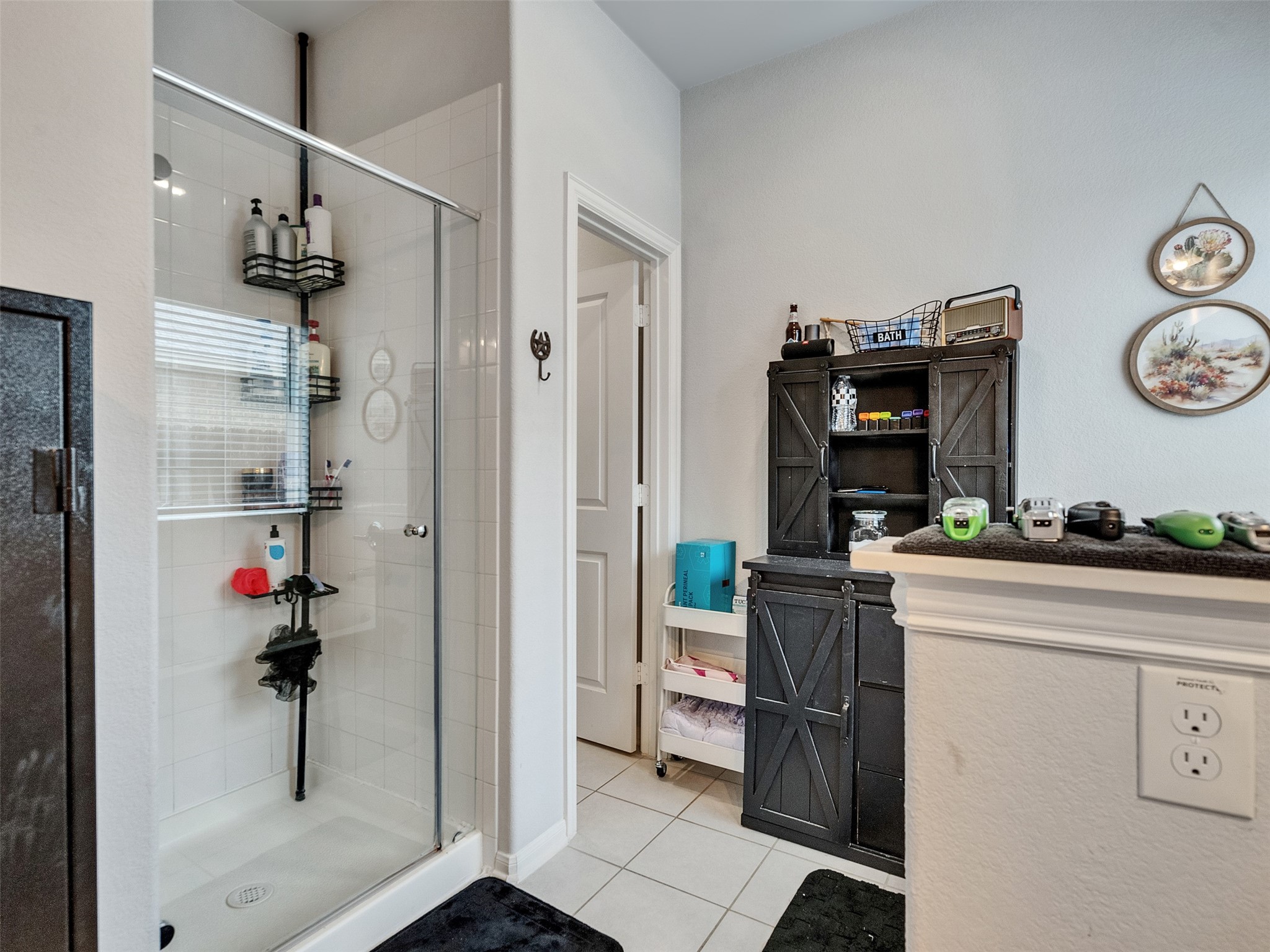 8719 Willet Street Baytown, TX 77521 - Photo 37 of 42 a kitchen with a refrigerator and a stove