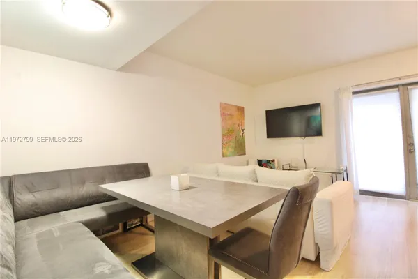 a living room with a couch and a flat screen tv