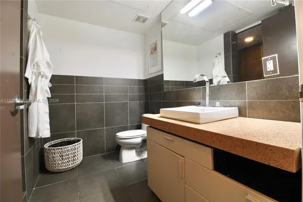 a bathroom with a sink and a toilet