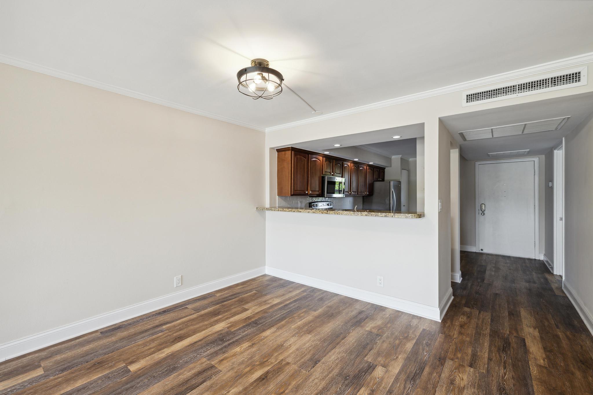 4 Royal Palm Way, Unit 2080 Boca Raton, FL 33432 - Photo 16 of 23 a view of a room with wooden floor and kitchen view