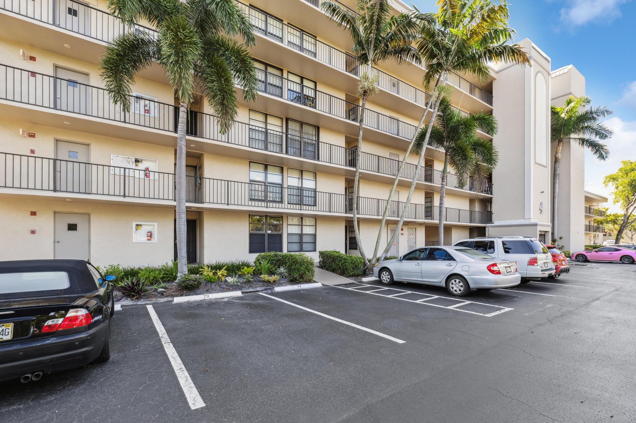 4 Royal Palm Way, Unit 2080 Boca Raton, FL 33432 - Photo 18 of 23 a cars parked in front of a building