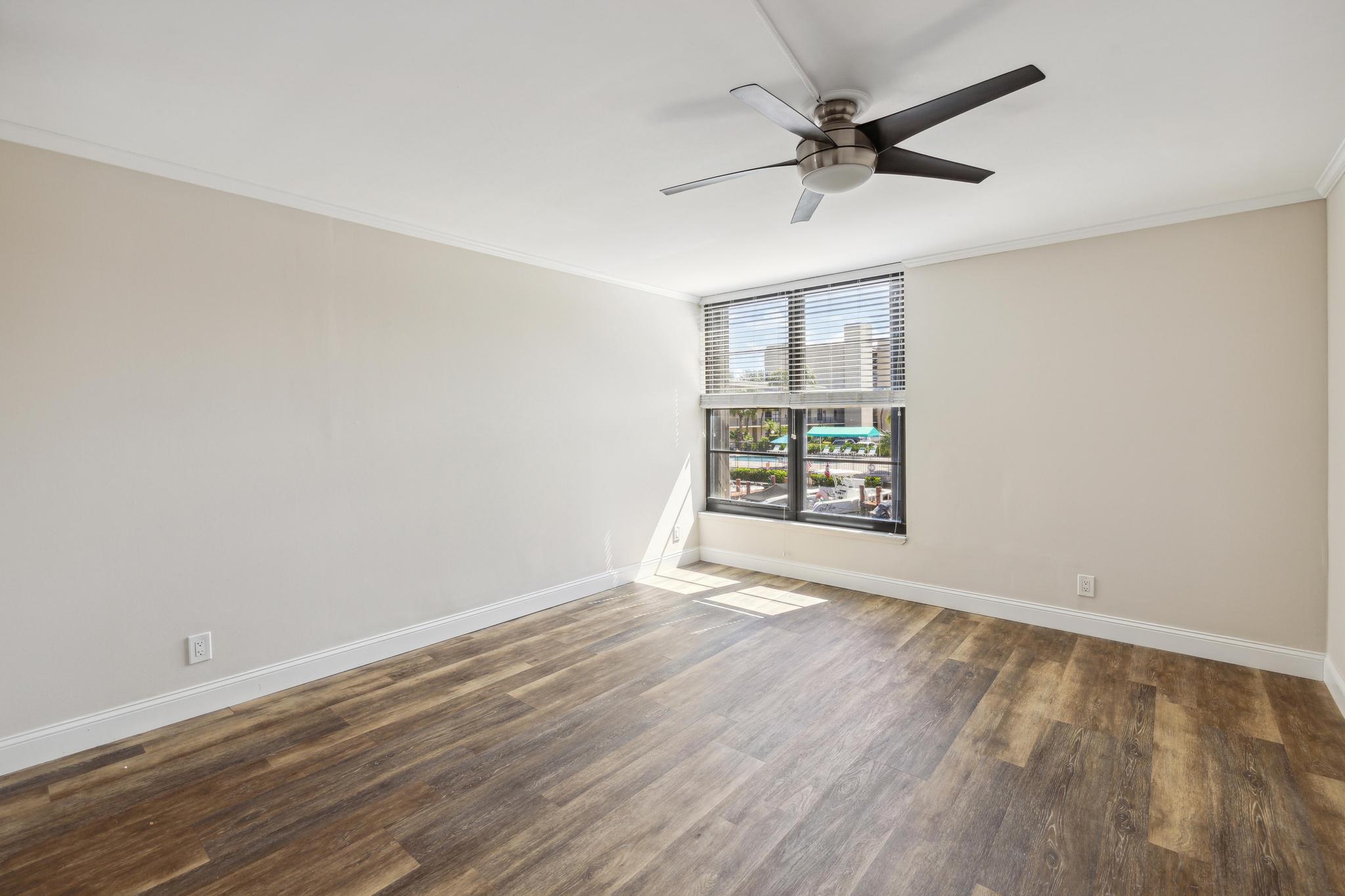 4 Royal Palm Way, Unit 2080 Boca Raton, FL 33432 - Photo 8 of 23 wooden floor in an empty room with a window