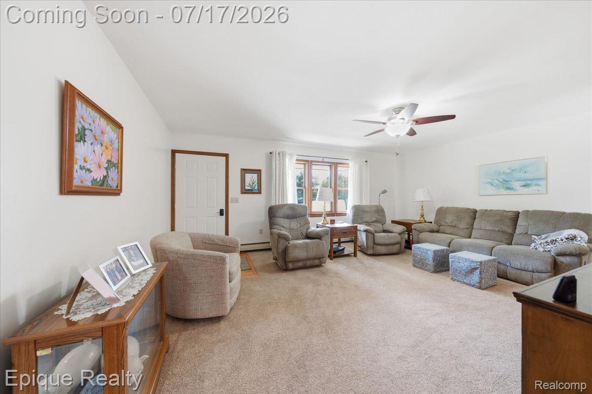 555 East Square Lake Road Troy, MI 48085 - Photo 8 of 48 Carpeted living space with a white ceiling and walls