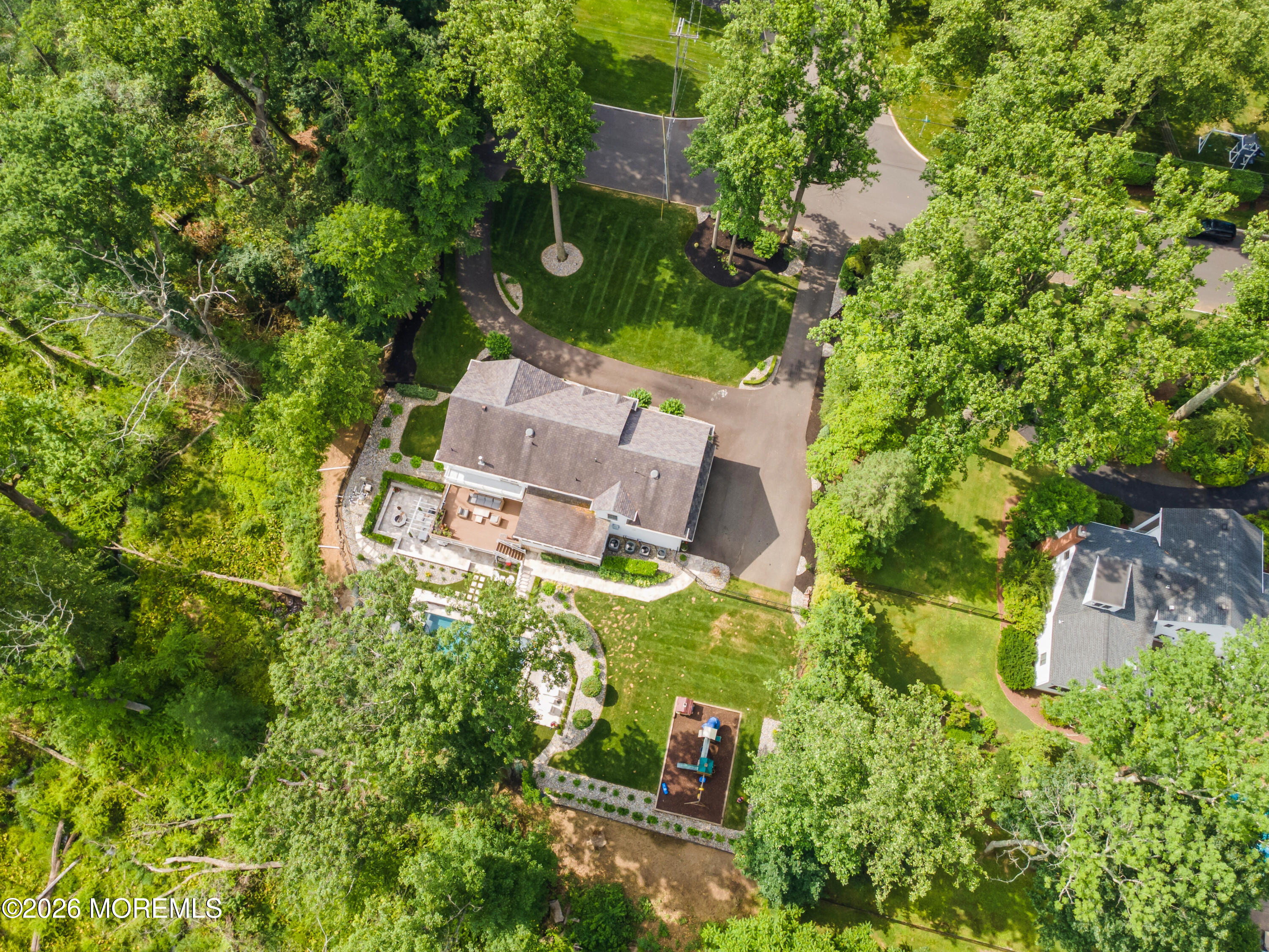 92 Tulip Lane Colts Neck, NJ 07722 - Photo 55 of 55 an aerial view of a house with a yard