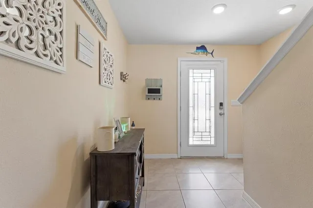 a room with pool table and windows