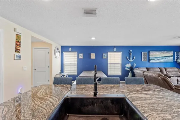 a bedroom with a bed a desk and chair