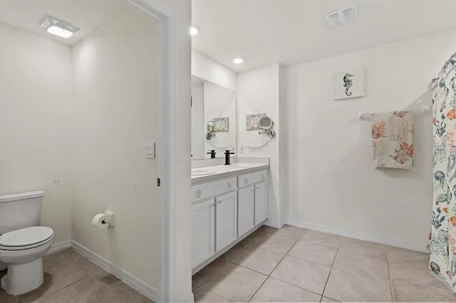 a bedroom with a bed and a desk