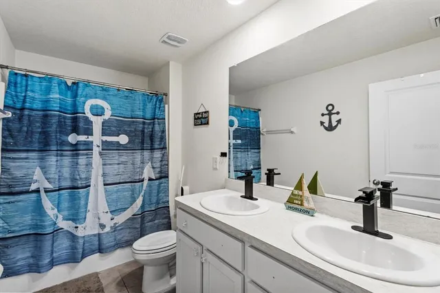 a view of a front view of a house with porch and a yard