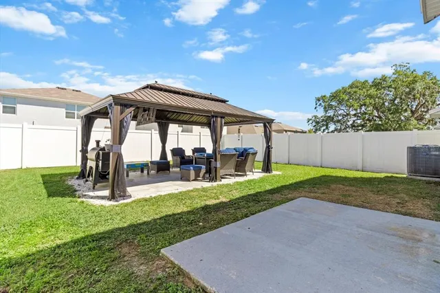 an aerial view of a house with a lake view