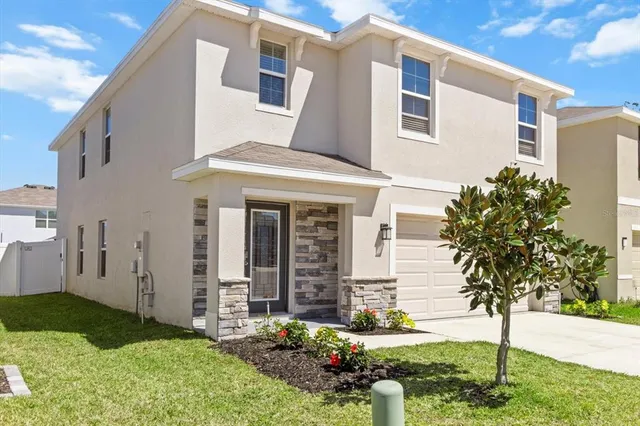 a workspace room with furniture and window