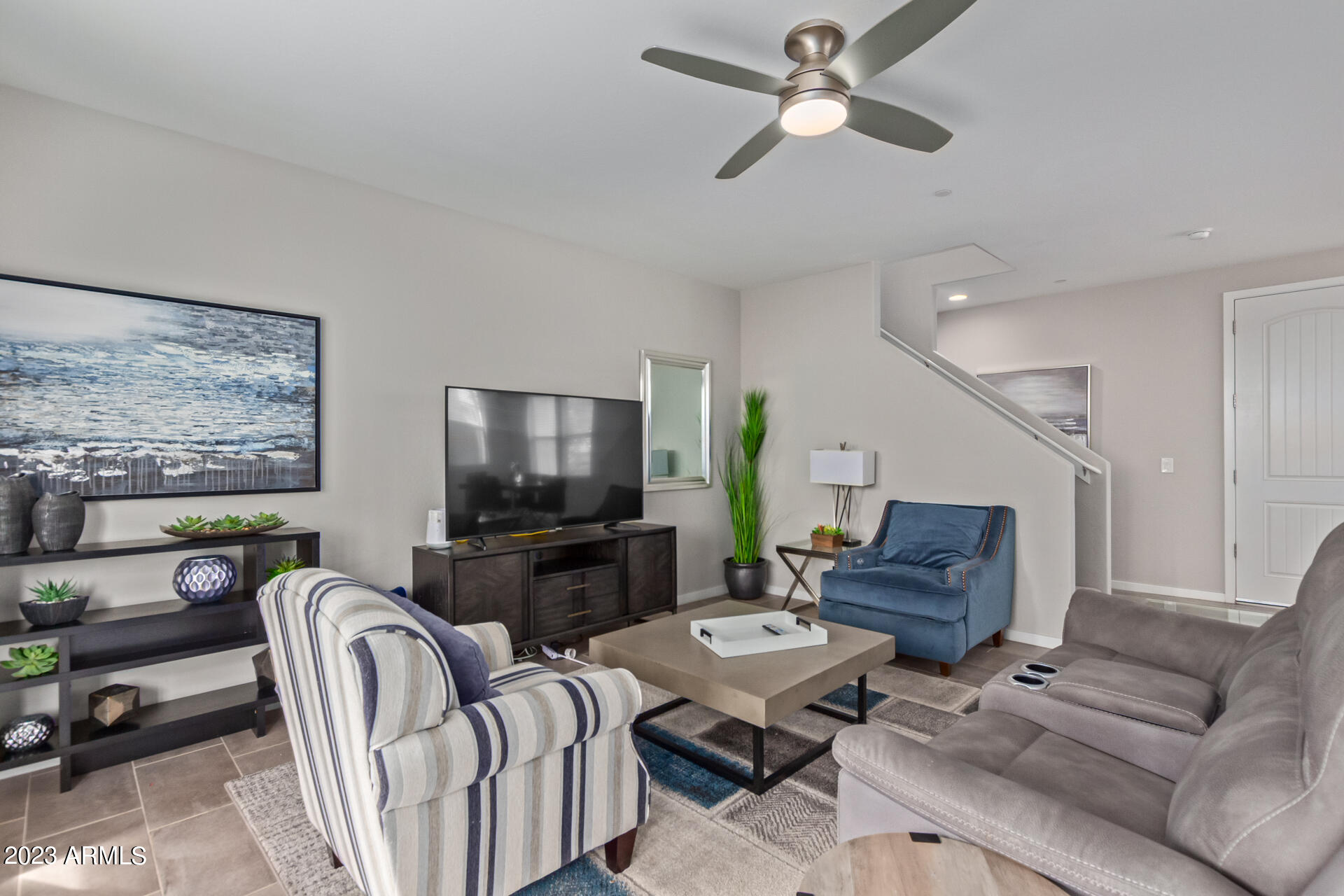 1954 South Follett Way Gilbert, AZ 85295 - Photo 11 of 38 a living room with furniture a ceiling fan and a window