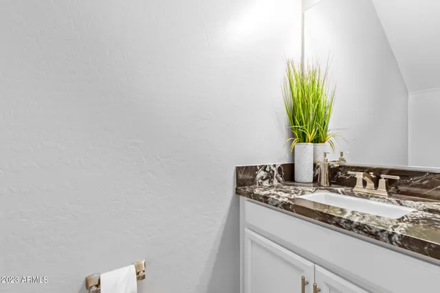 a close up of a sink and a mirror