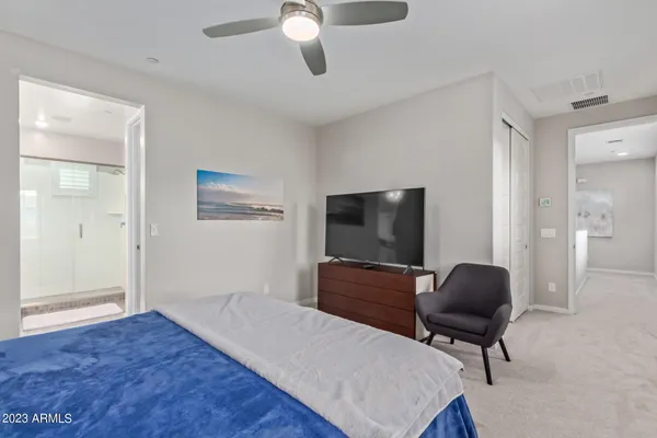 a livingroom with workspace and a window