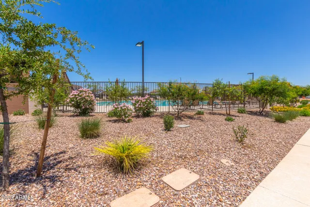 a view of a swimming pool with a patio