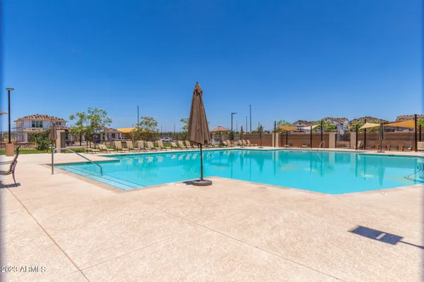 a view of swimming pool with a yard