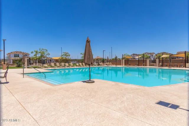 a view of swimming pool with a yard
