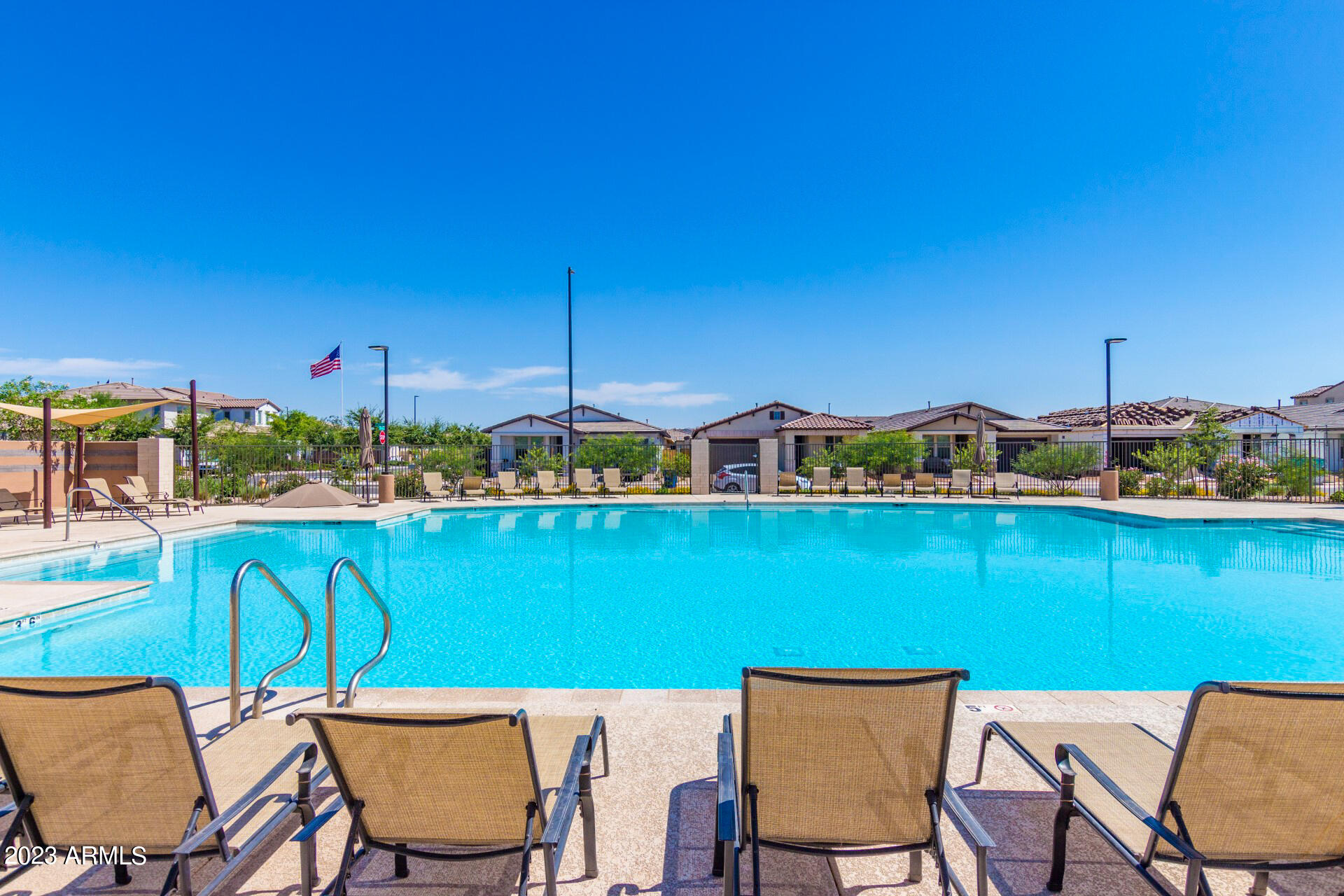 1954 South Follett Way Gilbert, AZ 85295 - Photo 34 of 38 a view of a chairs and table in patio with swimming pool