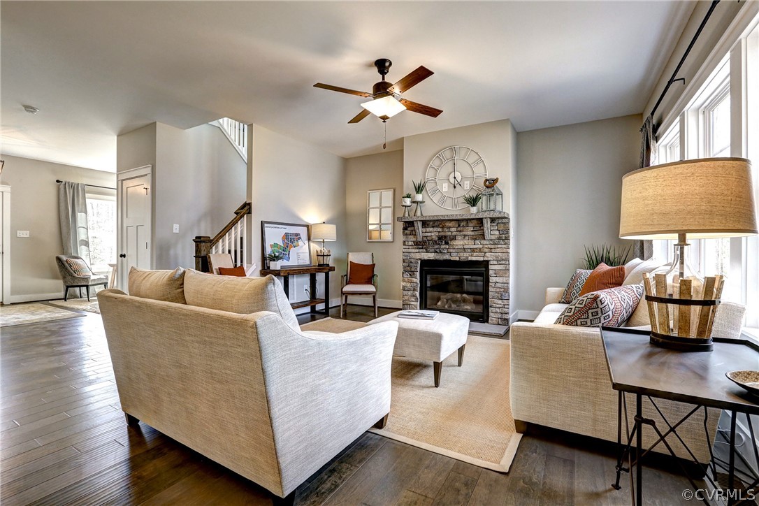 4900 Appelman Ridge Chesterfield, VA 23832 - Photo 2 of 11 a living room with furniture a fireplace and a chandelier