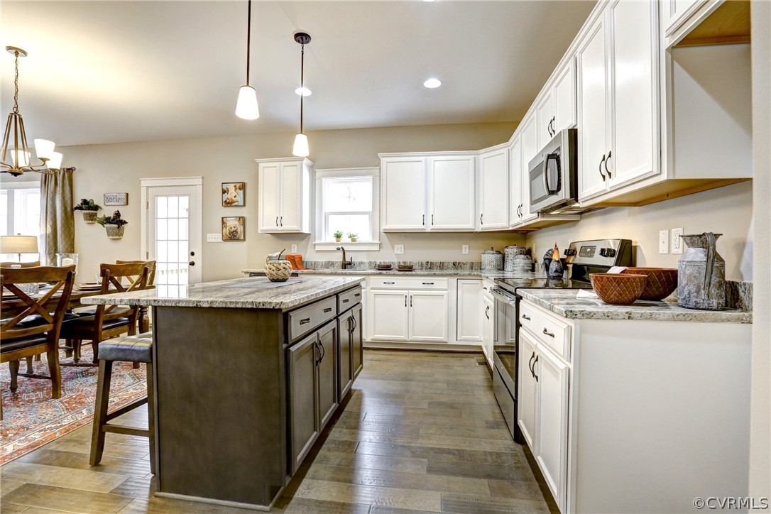 4900 Appelman Ridge Chesterfield, VA 23832 - Photo 5 of 11 a kitchen with stainless steel appliances granite countertop a stove a sink and a refrigerator