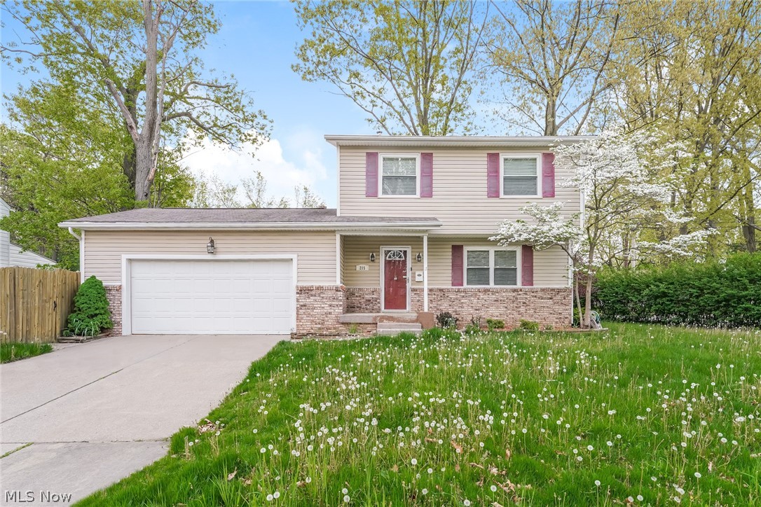 215 Randel Avenue Akron, OH 44313 - Photo 1 of 20 View of front of house with a garage and a front yard