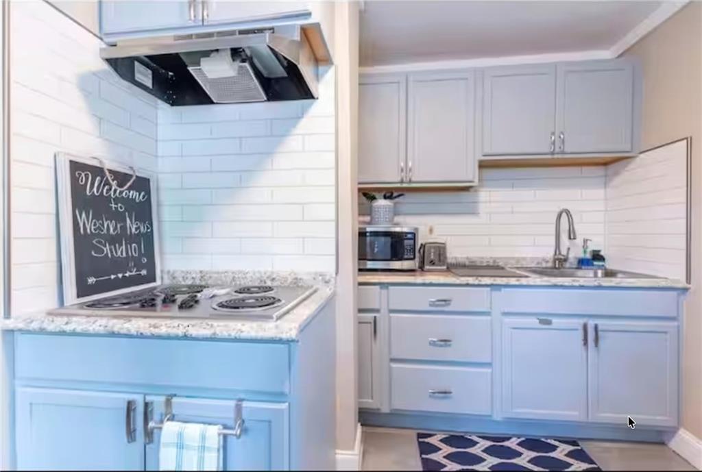235 Walnut Street Northwest, Unit G Atlanta, GA 30314 - Photo 5 of 10 a kitchen with stainless steel appliances granite countertop a sink and cabinets