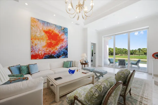 a view of a living room and floor to ceiling window