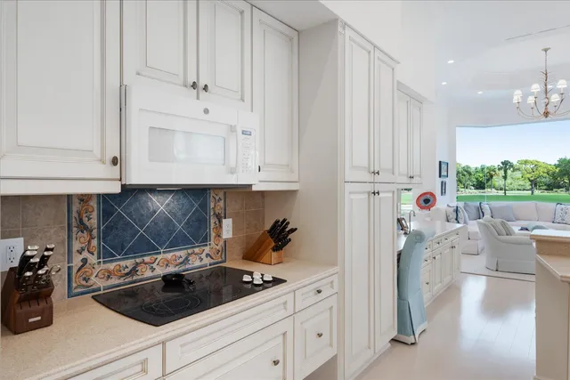 a kitchen with stainless steel appliances a refrigerator sink and cabinets