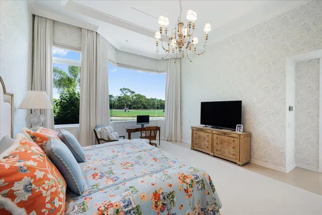 a spacious bathroom with a tub a sink and mirror