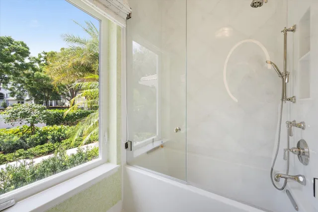 a bedroom with bed and window