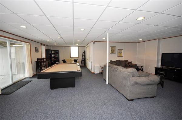 113 Acton Street Maynard, MA 01754 - Photo 11 of 20 a living room with furniture and a flat screen tv