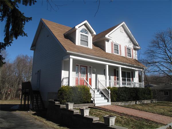113 Acton Street Maynard, MA 01754 - Photo 20 of 20 a front view of a house with garden