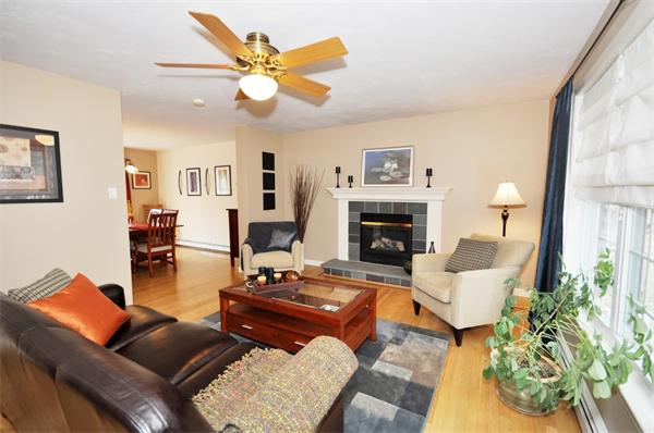 113 Acton Street Maynard, MA 01754 - Photo 3 of 20 a living room with furniture fireplace and a large window