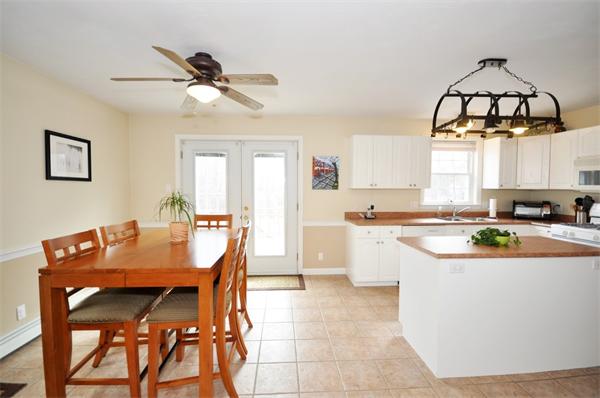113 Acton Street Maynard, MA 01754 - Photo 5 of 20 a view of a dining room with a table and chairs