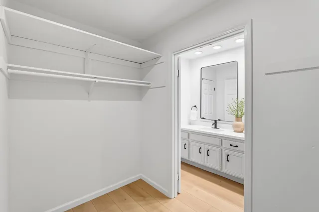 a bedroom with bed and a window