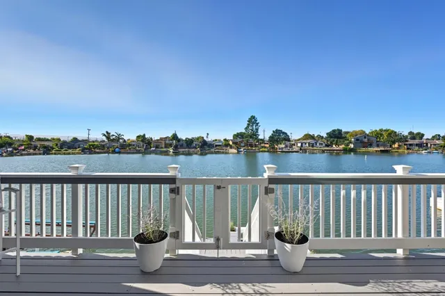 a view of house with seating space and wooden floor