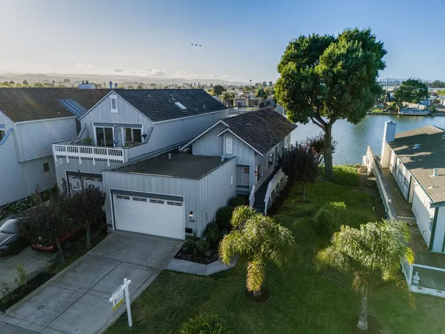 a view of a house with yard porch and sitting area