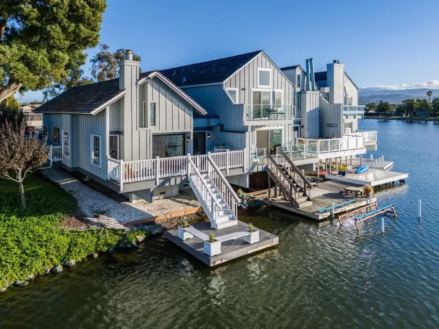 an aerial view of a house with a ocean view