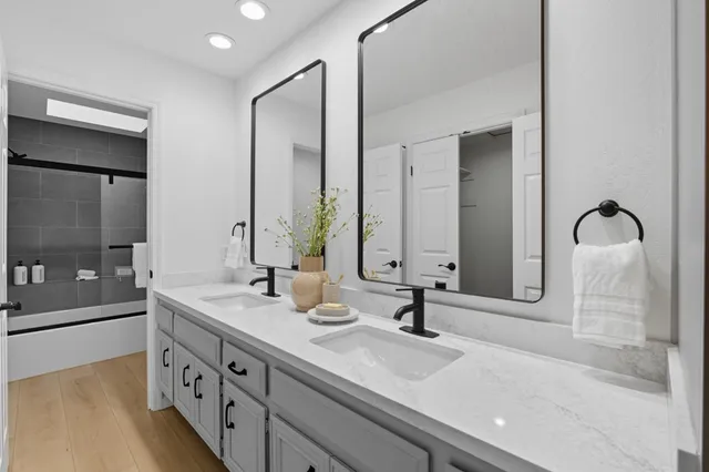 a bathroom with a bathtub and a shower