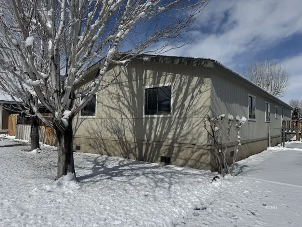 a view of a house with a tree