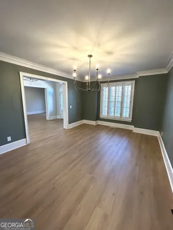 a view of an empty room and glass door