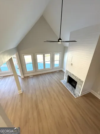 a kitchen with granite countertop a stove sink and cabinets
