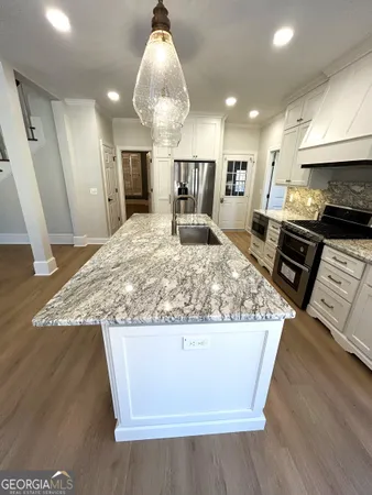 a view of a living room and a wooden floor