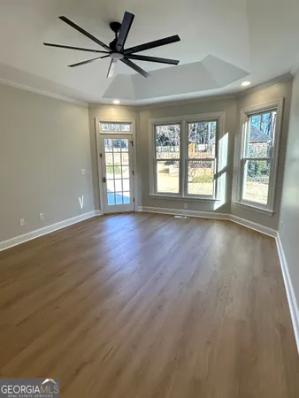 a view of entryway and hall with wooden floor