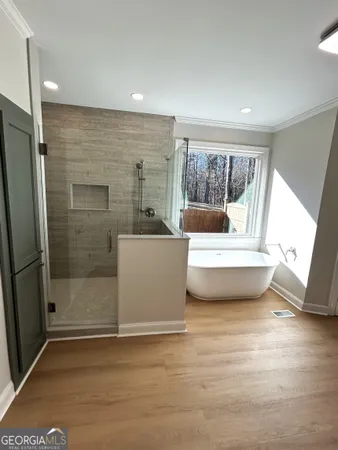 a view of an empty room with a window