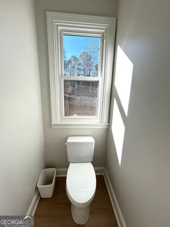 a bathroom with a shower and toilet