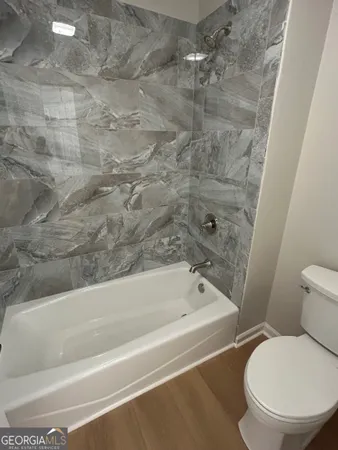 a view of a town with large trees