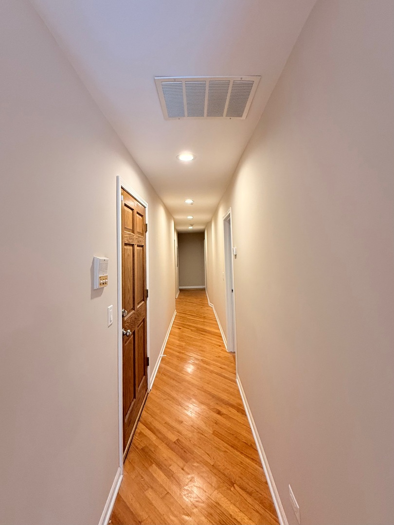 1534 East Marquette Road Chicago, IL 60637 - Photo 11 of 23 a view of a hallway with wooden floor