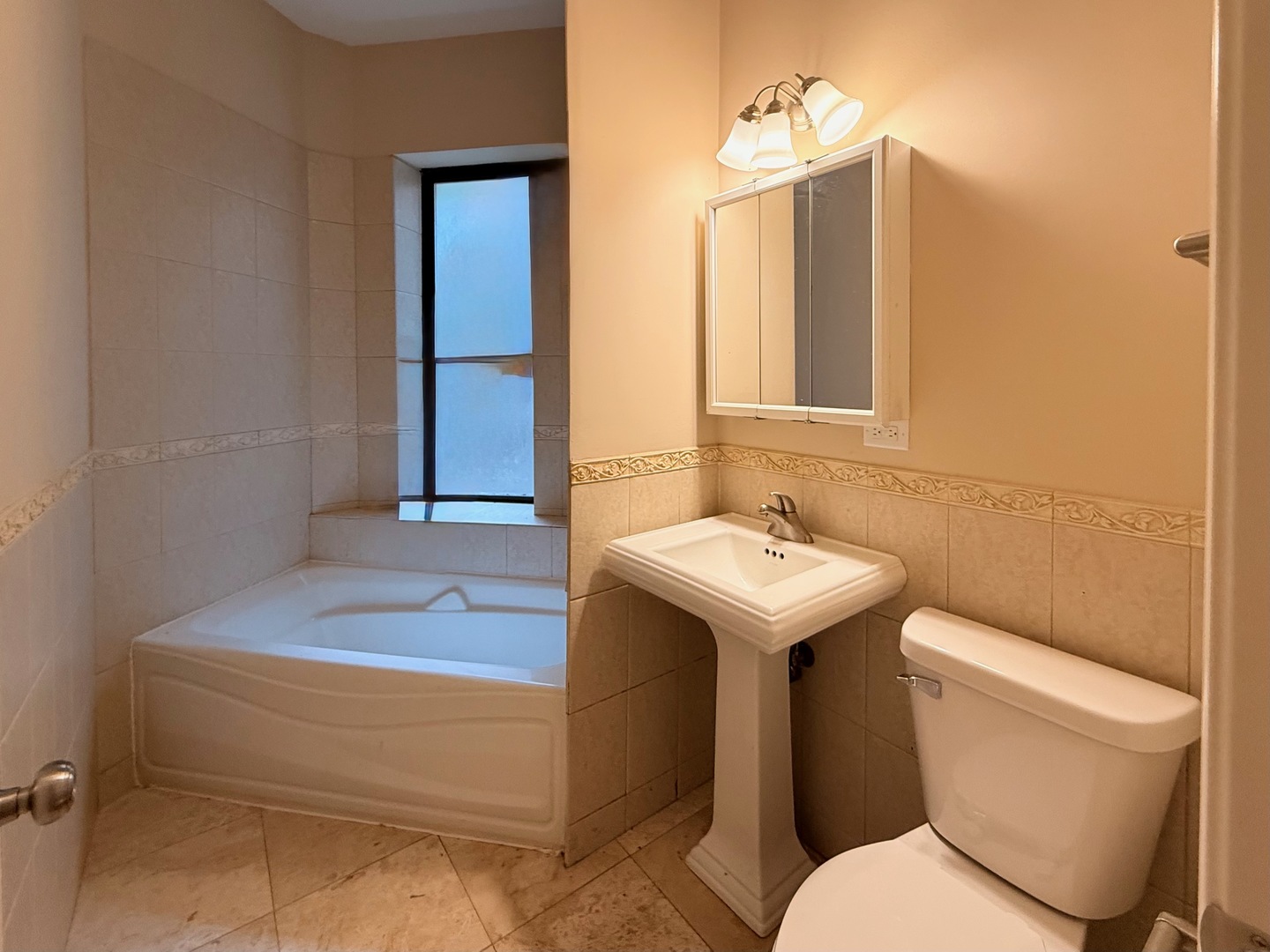 1534 East Marquette Road Chicago, IL 60637 - Photo 16 of 23 a bathroom with a sink toilet and mirror