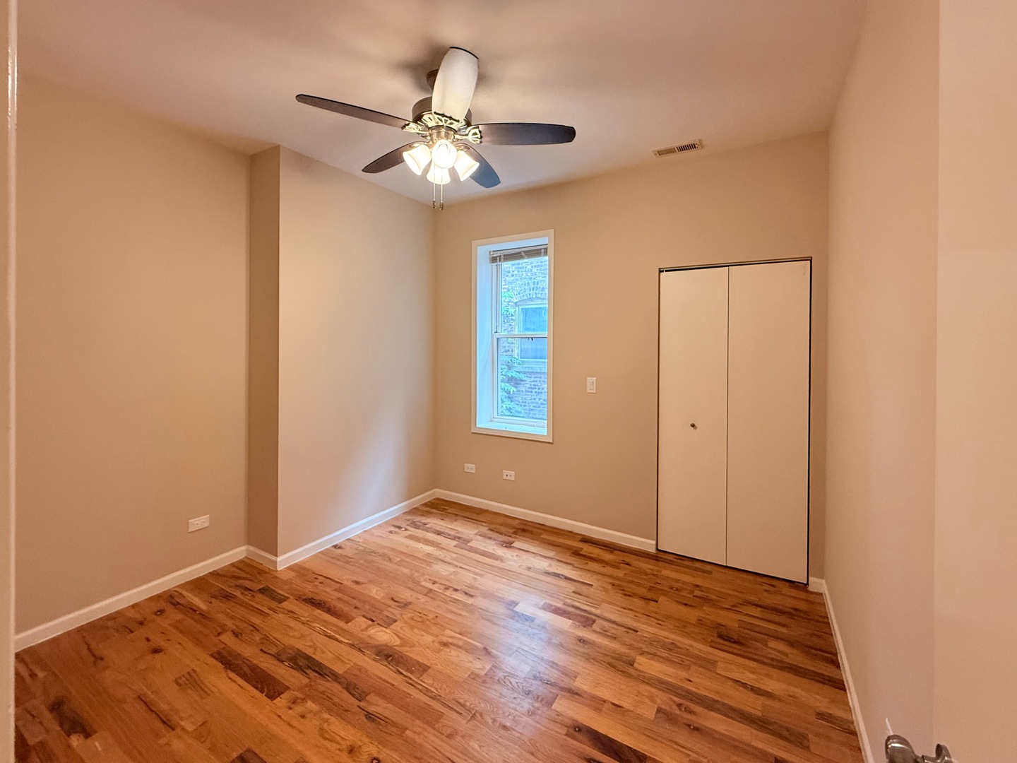 1534 East Marquette Road Chicago, IL 60637 - Photo 17 of 23 a view of an empty room with wooden floor