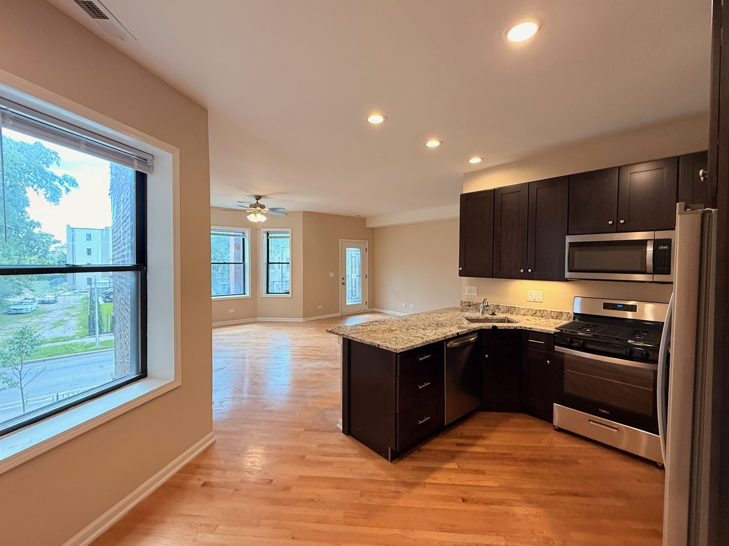 1534 East Marquette Road Chicago, IL 60637 - Photo 2 of 23 a kitchen with stainless steel appliances granite countertop a stove and a refrigerator